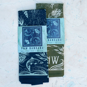Two patterned bandanas with packaging on a textured white background.