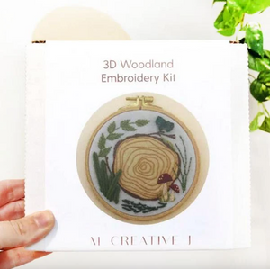 3D Woodland Embroidery Kit packaging with an embroidered design of a tree stump and nature elements.
