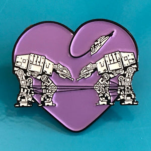 Heart shaped enamel pin called Love AT-AT First Sight with a purple background.