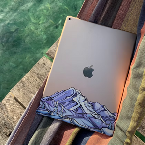 Mount Rainier infinity sticker shown cut and placed on a laptop, overlapping to create a multi level landscape.