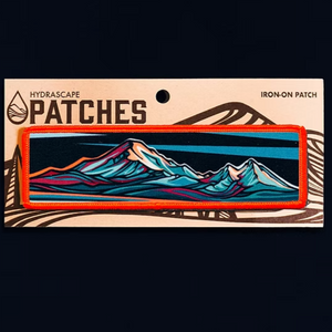 Iron-on patch with mountain design on a black background