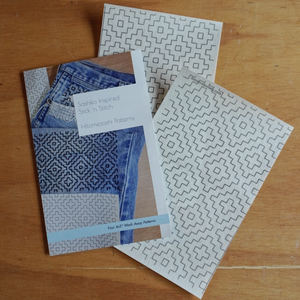 Visible mending patterns on a wooden surface.