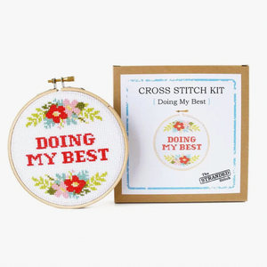 Cross stitch kit with hoop and completed design 'Doing My Best' on a white background