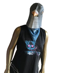 A mannequin wearing a black sleeveless top with a colorful cat graphic and a gray bird mask, standing in a store window.