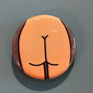 Round zipper pull with a thin butt design against a gray background.