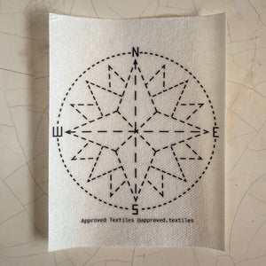 Visible mending pattern sticker featuring a compass rose.