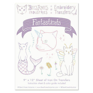 Embroidery transfers with cat designs on a white background
