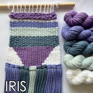Woven wall art with striped pattern and skeins of yarn on a white background, featuring the brand 'IRIS'.