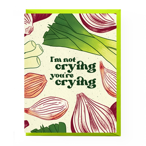 Card with red onions and leeks design and text 'I'm not crying, you're crying' on a white background