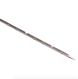 Close up of long, thin metal felting needle on a white background.