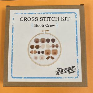 Brown kraft box with a photo of the Boob Crew design on the front.