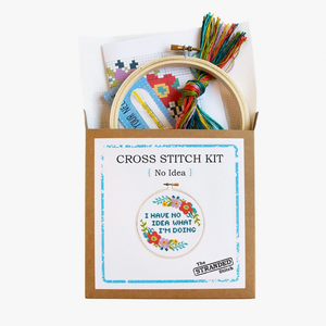 Cross stitch kit with hoop and colorful threads in a box labeled 'No Idea' by The Stranded Stitch.