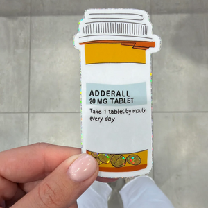 Sparkly sticker depicting a bottle of Adderall.
