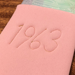 The back of a pink can cooler with 1963 embroidered on the back.