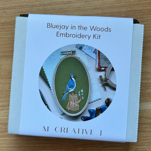 Packaging for M Creative J's embroidery kit called Bluejay in the Woods