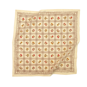 Cream colored bandana with a grid pattern that has a floral pattern within.