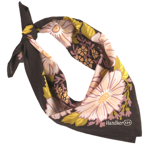 Floral patterned bandana folded and tied into a neck scarf.