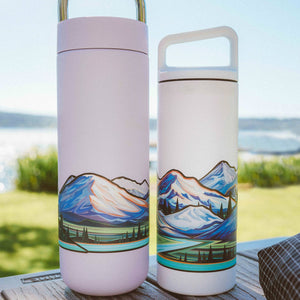 Two water bottles with the large infinity sticker of the cascade volcanoes on each of them