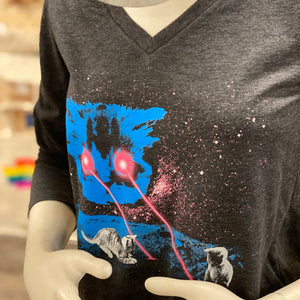 Black long-sleeve shirt with a graphic design of a blue cat head shooting lasers out of its eyes. There are two tiny kittens playing with the lasers.