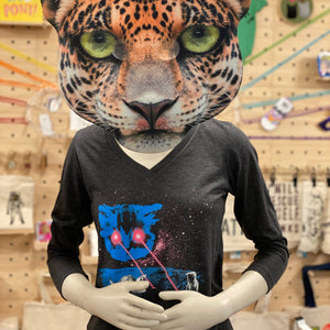 Mannequin wearing a leopard head mask and heather gray shirt with blue space cat head shooting lasers out of its eyes. There are tiny kittens playing in the lasers.
