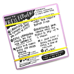 Instructions for pressing flowers on a purple card with black text and yellow highlights.