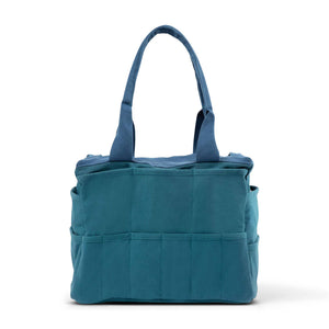 Blue tote bag from the back with multiple pockets on a white background
