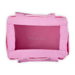 Pink tote bag with 'YOU DO YOU' text on a white background
