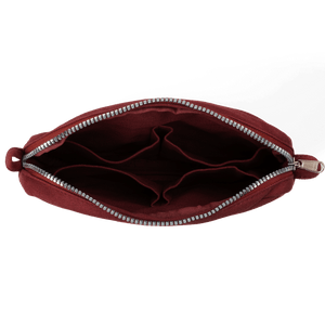 Red pouch with a zipper on a black background