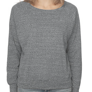 Person wearing a gray sweater and jeans on a white background.