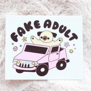 Cartoon pug in a car with 'FAKE ADULT' text on a white background