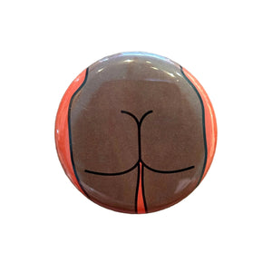 Round button featuring a design of a butt on an orange background.