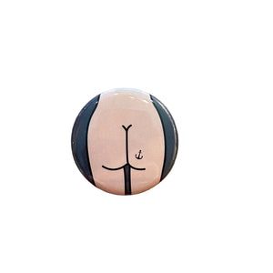 Round button with a butt design on a textured surface