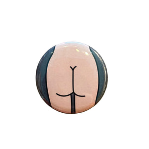 Round button with a butt design on a textured surface