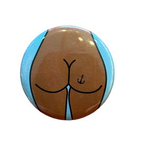 Button with a design of a buttocks and anchor