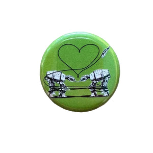 Green button with robot design and heart