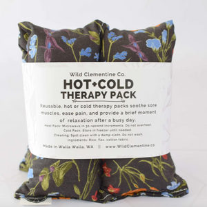 Hot and cold therapy pack with floral design on a white background