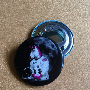 Bottle opener keychain with Astronaut unicorn design on a glittery surface.