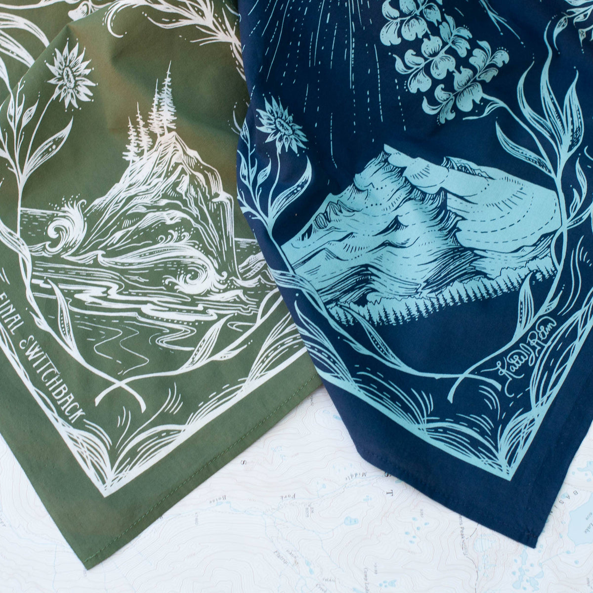 Two bandanas with nature-themed designs on a light background. 