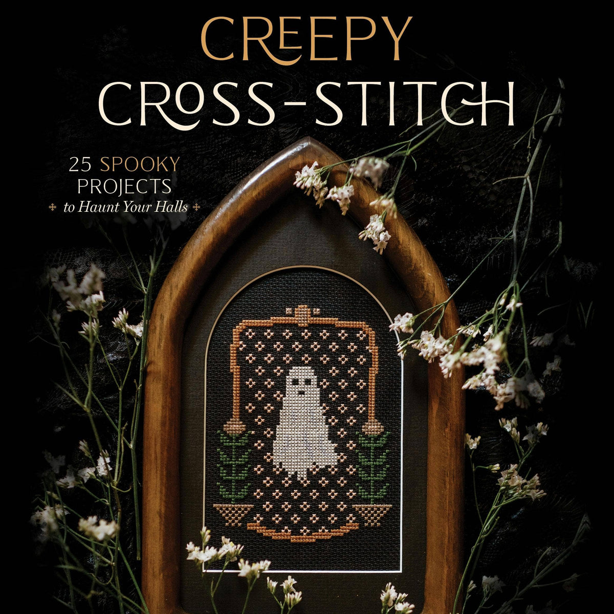 Book cover of 'Creepy Cross-Stitch' with a cross-stitched ghost design in a wooden frame.