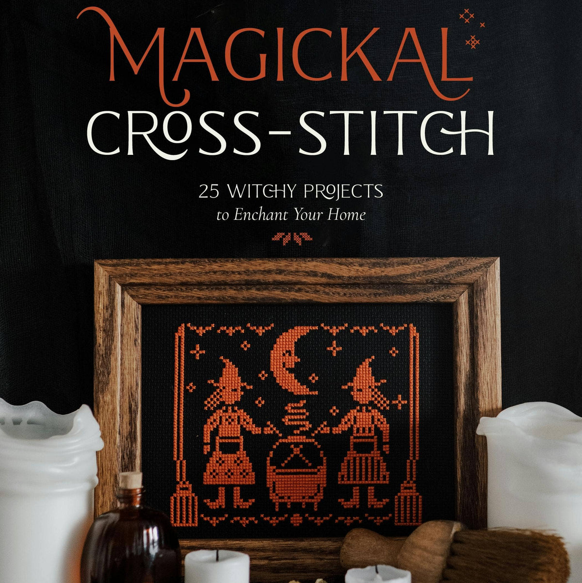 Book cover of 'Magickal Cross-Stitch' with a cross-stitched design and candles on a dark background.