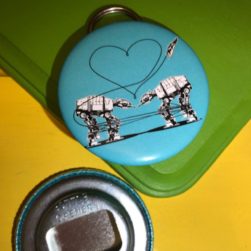 Bottle opener with Love AT-AT First Sight design on a green and yellow background.