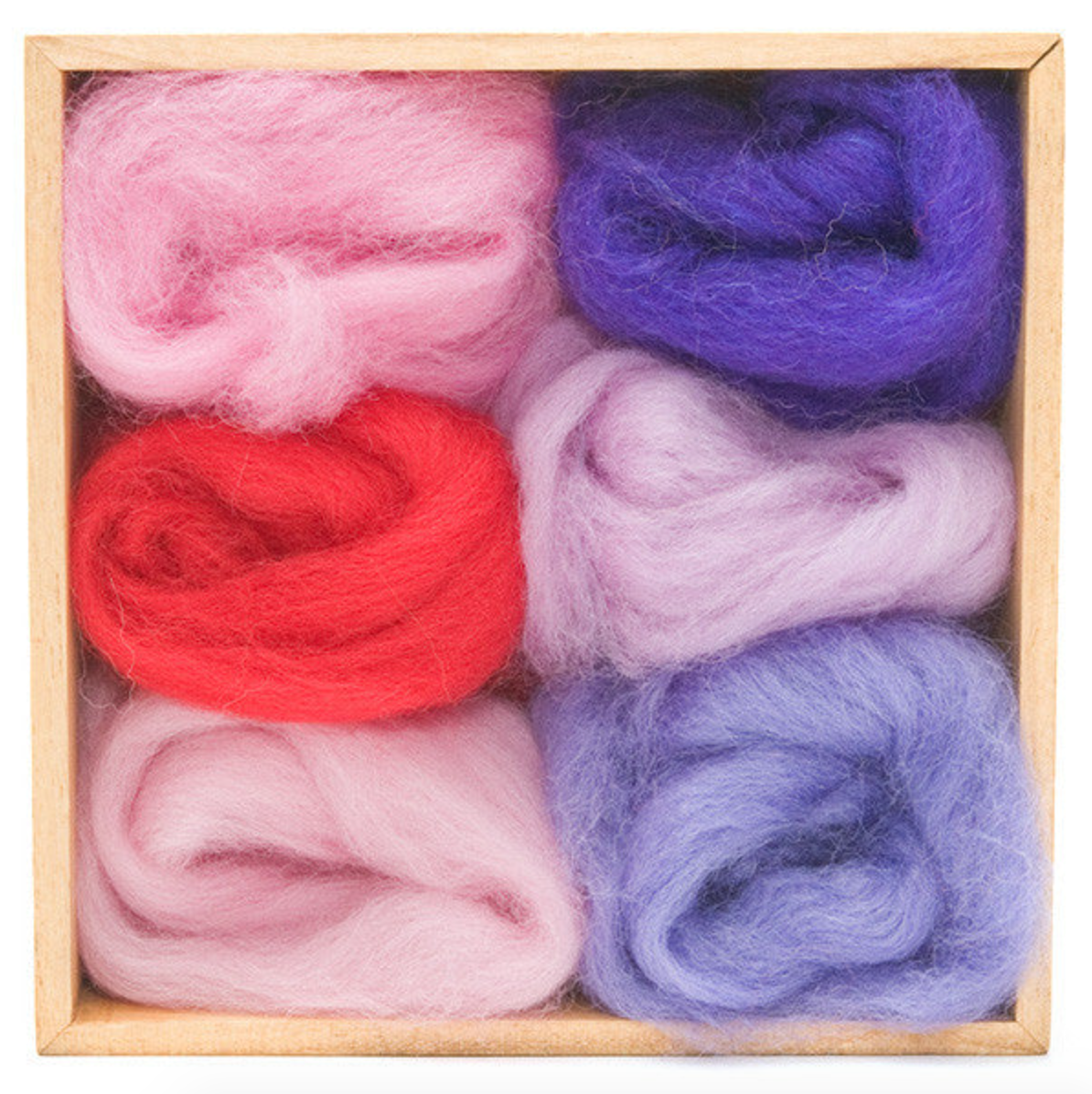Set of colorful roving balls in a wooden box. 
