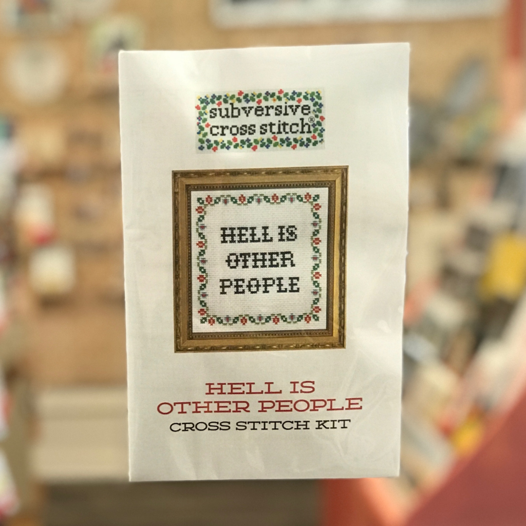 Packaged craft kit that says "Hell is other people" by Subversive Cross Stitch