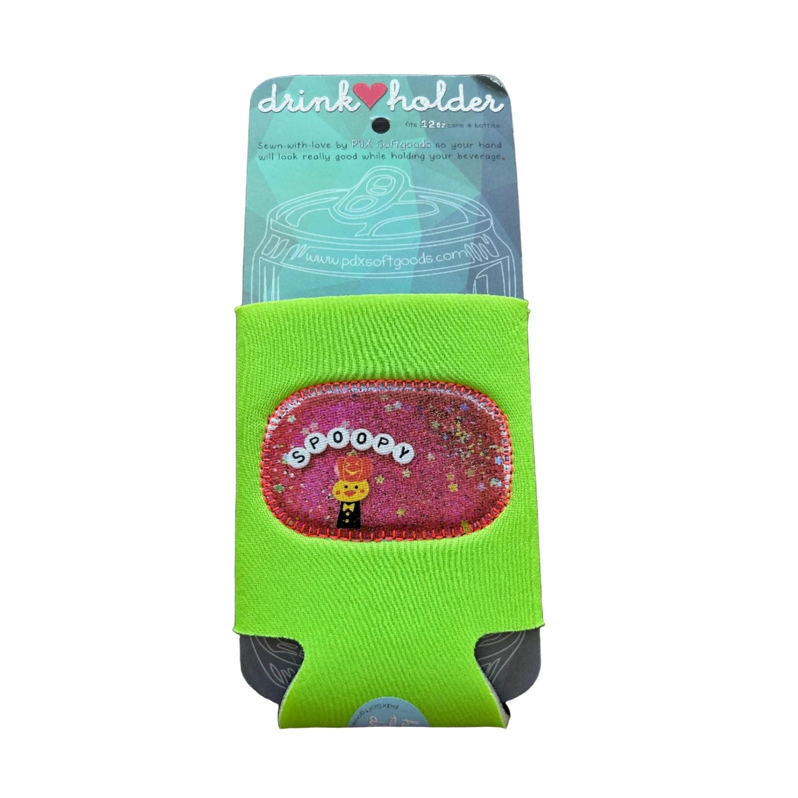 Green drink holder with 'Spoopy' design on a wooden surface. 