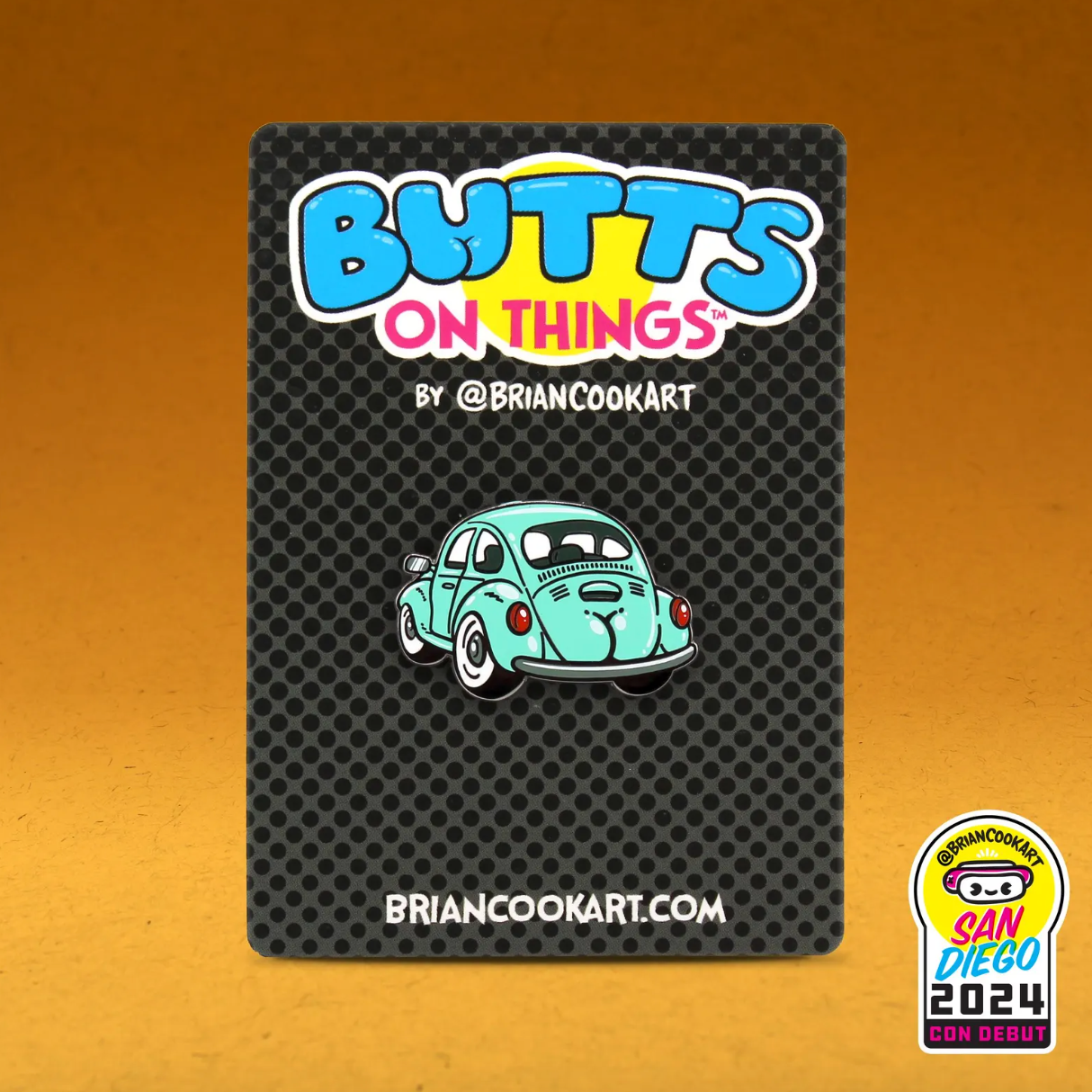 Pin with a VW car with a butt design on a textured card with 'Butts on Things' branding.