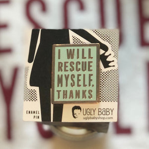 Mint colored rectangular enamel pin that says "I will rescue myself, thanks" in rose gold lettering. It is displayed on a black and white backing card. 