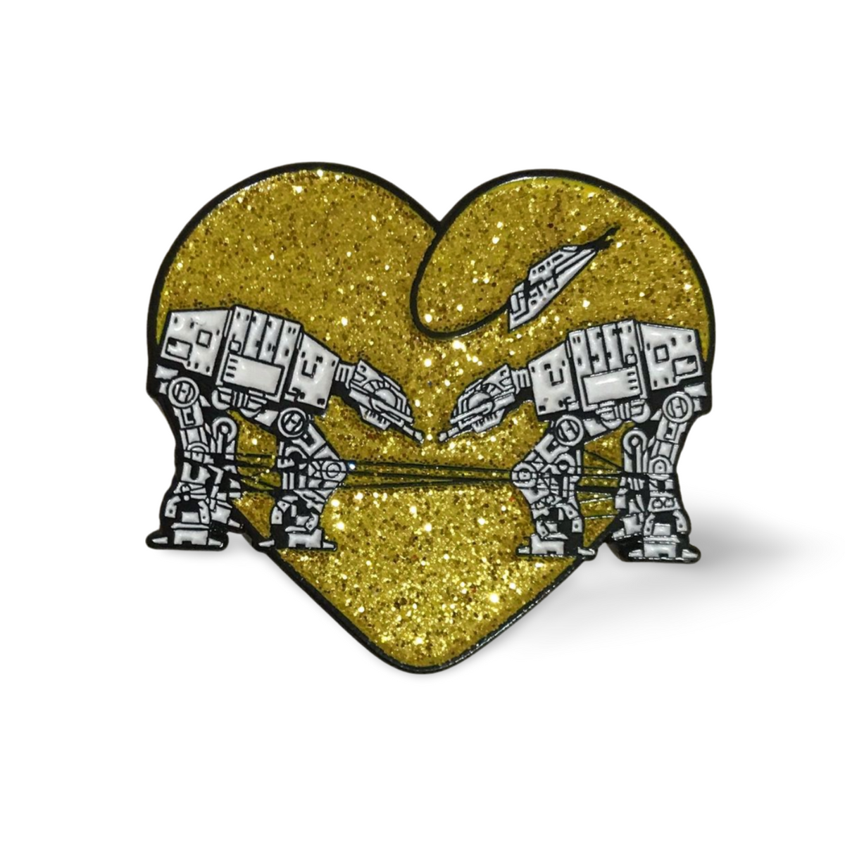 Heart shaped enamel pin called Love AT-AT First Sight with a gold glitter background.