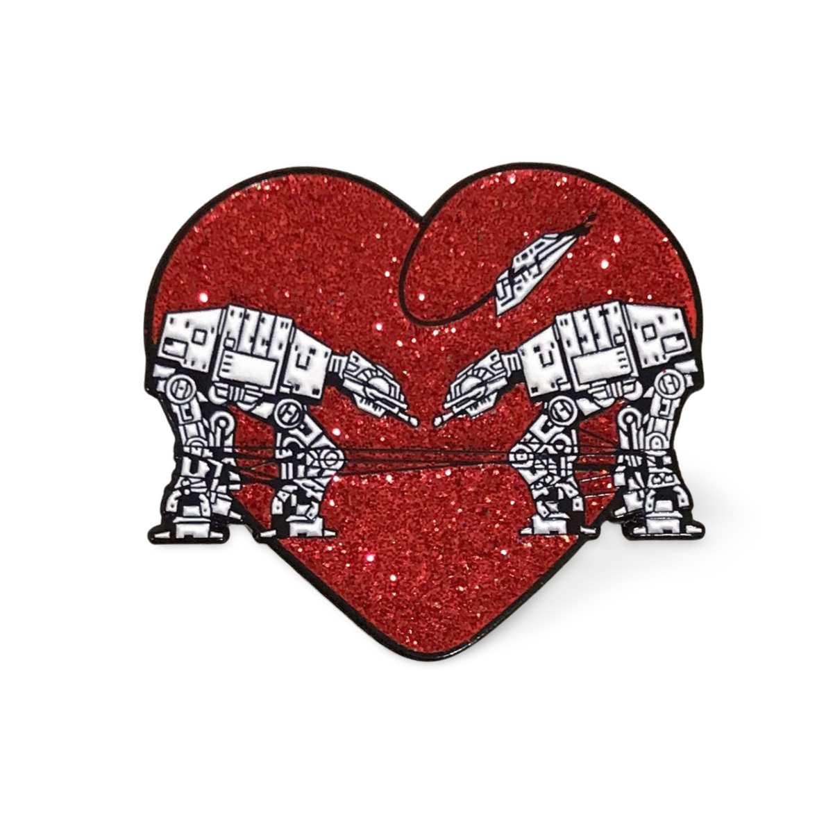 Heart shaped enamel pin called Love AT-AT First Sight with a red glitter background. 
