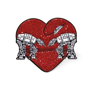 Heart shaped enamel pin called Love AT-AT First Sight with a red glitter background. 