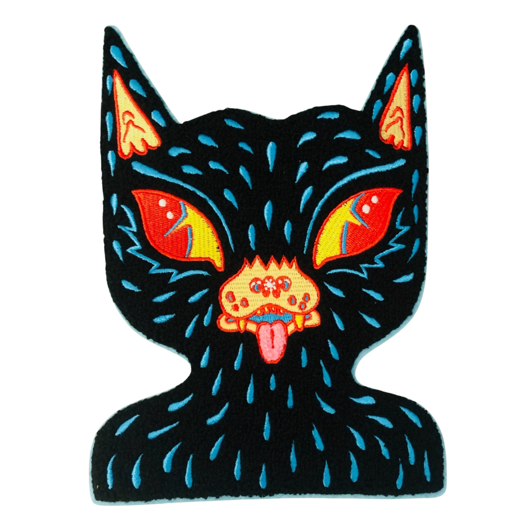 Black cat patch with colorful eyes and tongue on a white background